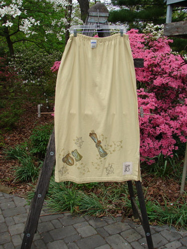 1999 NWT Side Vent Skirt Fancy Gathering Plantain Size 2 displayed on a rack, featuring a simple straight fall, side vents, deep pockets, and a unique gathering theme paint design.