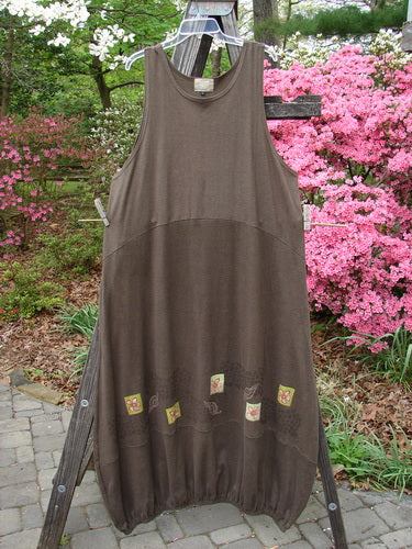 2000 Cotton Hemp Libby Jumper Leaf Flower Bark Size 2 displayed on a wooden rack, featuring side pockets, a downward scooped waistline, and a bubbled shape with floral and leaf patterns.