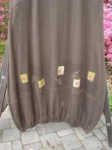 2000 Cotton Hemp Libby Jumper Leaf Flower Bark Size 2, featuring a downward scooped waistline, side pockets, bubbled shape, and leaf and flower theme paint, shown on a textured surface.