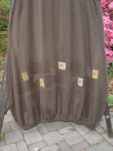 2000 Cotton Hemp Libby Jumper Leaf Flower Bark Size 2: A brown skirt with flower patterns, featuring a downward scooped waistline, two side pockets, and a bubbled lower shape.