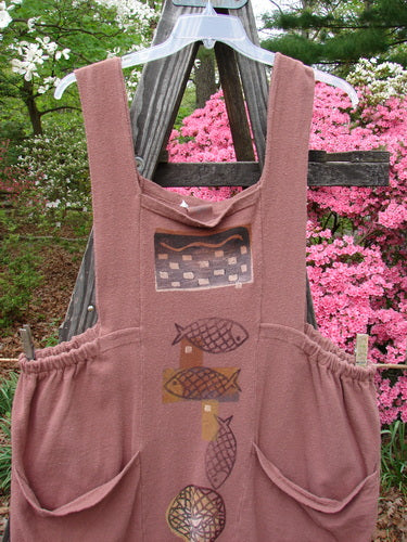 1995 Reprocessed Cottage Jumper Sea of Fish Clove Size 3, featuring playful fish patterns, thick shoulder straps, elastic side accents, sectional bib, and oversized front pockets.