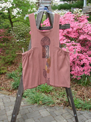 1995 Reprocessed Cottage Jumper Sea of Fish Clove Size 3 displayed on a wooden ladder, featuring thick shoulder straps, a sectional bib, elastic side accents, and two large front pockets.