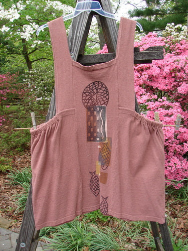 1995 Reprocessed Cottage Jumper Sea of Fish Clove Size 3 displayed on a wooden structure, featuring thick shoulder straps, sectional bib, elastic side accents, and two oversized front exterior pockets.