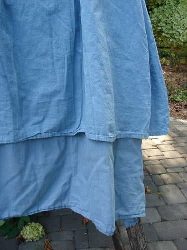 Barclay NWT Batiste Layer Skirt Unpainted Green Sea Size 0, featuring two-tiered design with full elastic waist, crafted from lightweight organic cotton batiste, hanging outdoors amidst greenery.