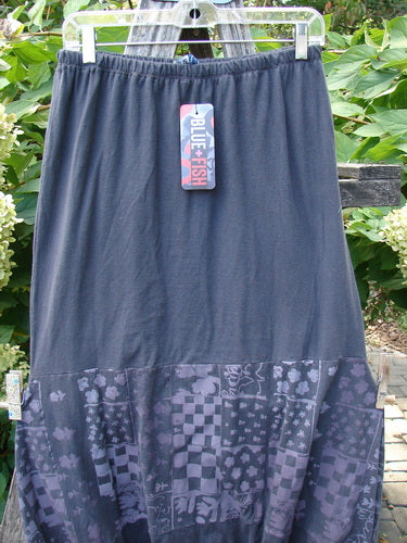 Barclay NWT Sprig Skirt Grid Garden Black Sand Size 0 features a tiered design with an elastic waistband and patchwork-style print, highlighted by a swing tag reading “BLUE FISH.”