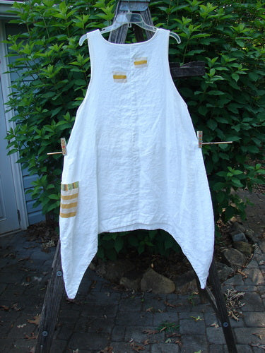 Barclay Linen Single Side Pocket Pinafore Geos White Size 1 hanging outdoors, showcasing its A-line flair, deeper scoop neckline, and unique side pocket with a geometric theme, reflecting Bluefishfinder.com's vintage style.