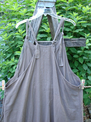Barclay Linen Rayon Pucker Side Pocket Apron Jumper Unpainted Bark Size 1 featuring adjustable straps, double front pockets, and a varying hemline, capturing the unique vintage style of BlueFishFinder.com.