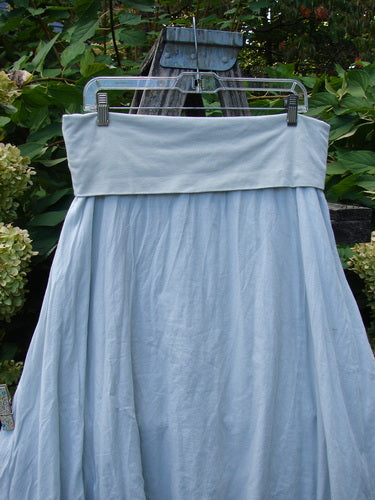 Barclay NWT Batiste Fold Over Raglan Silhouette Skirt Unpainted Dew Size 1, showcased on a hanger, features a full-skirted, tiered design with frayed edges, offering an airy, vintage appeal.