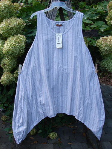 Barclay NWT Percale Hado Shift Stripe Smoke Pearl Size 1: A sleeveless, lightweight tunic with asymmetric hem and vertical pinstripes, hanging outdoors, showcasing its A-line shape and crisp cotton percale fabric.