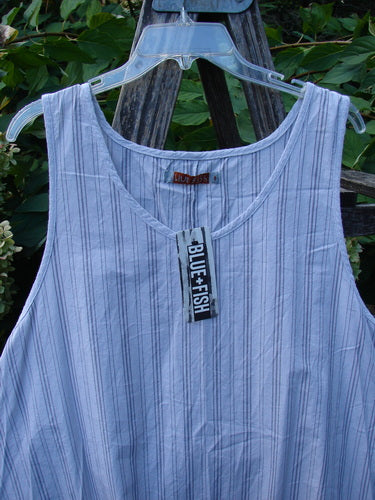 Barclay NWT Percale Hado Shift Stripe Smoke Pearl Size 1 tank top with fine vertical stripes, featuring a scoop neckline, A-line shape, and varying hem, displayed outdoors against green foliage.