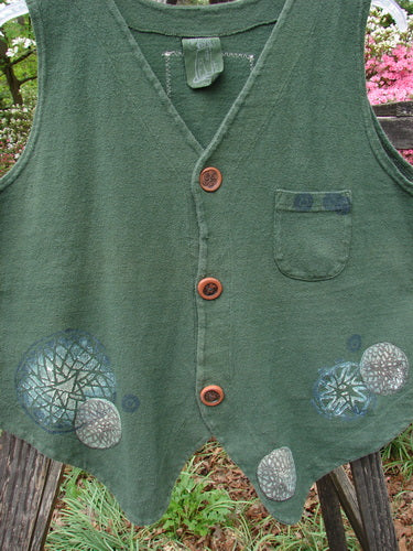 1995 Reprocessed Drawing Room Vest Star Spin Green Tea OSFA with ceramic button front, shirt tail hemline, tailored drawcord back, front pocket, and vintage paint, showcased in thick cotton fabric.