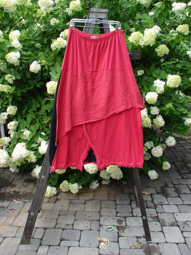 Barclay NWT Mixed Media Swatch Skirt Unpainted Black Rose Size 2 displayed on a clothes rack, showcasing its layered textures, sectional panels, and full elastic waistline.