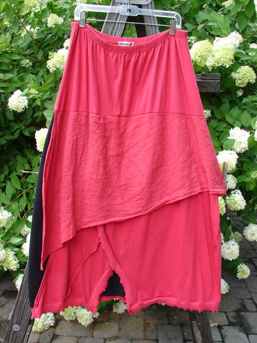 Barclay NWT Mixed Media Swatch Skirt Unpainted Black Rose Size 2 displayed on a rack, showcasing its layered textures, sectional panels, and full elastic waistline.