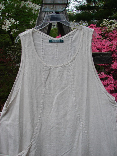 Barclay Slub High Vent Figure 8 Lace Pocket Pinafore Dress Unpainted Crème Size 2 displayed on a clothes swinger, highlighting unique figure-eight seams, drop side pockets, and lacy hem accents.