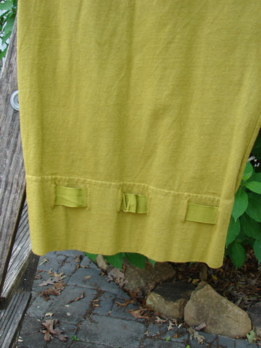 Barclay Bow Bottom Pantaloon Unpainted Green Olive Size 0, showcasing the elastic waistline, full draw cord, and flat textured ribbon bows, highlighting unique buttonholes and tapering details at the cuffs.