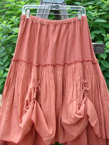 Barclay Hemp Linen Batiste Fusion Pant Skirt Autumn Harvest Size 0 features a unique design with triangular patches and dual ties, showcasing a layered look on a clothesline, embodying Bluefishfinder.com's vintage elegance.