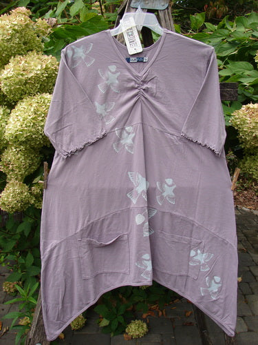 Barclay NWT Perfect Day Pocket Tunic Dress Love Dove Sea Fog Size 0 features a lavender tunic with a V-neck, scalloped sleeves, bird-and-leaf print, and front pockets, embodying Bluefishfinder.com's vintage style.