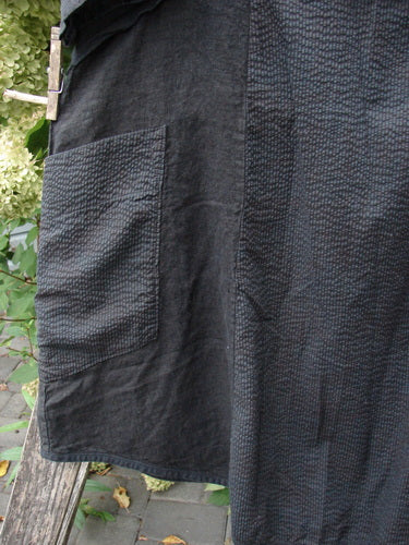 Barclay NWT Linen Pucker Heart and Soul Pocket Dress in dark-charcoal, featuring a waffle texture, large square patch pocket, and wooden clothespin on a clothesline, embodying unique textures and design.