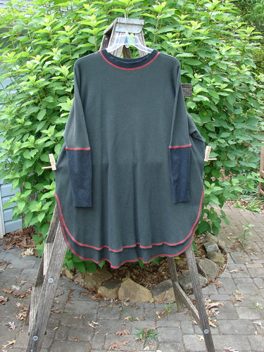 Barclay Thermal Contrast Revival Top Unpainted Black OSFA displayed on a clothes rack, showcasing its textured thermal fabric, ribbed sleeves and neckline, and unique A-line shape with side vents.