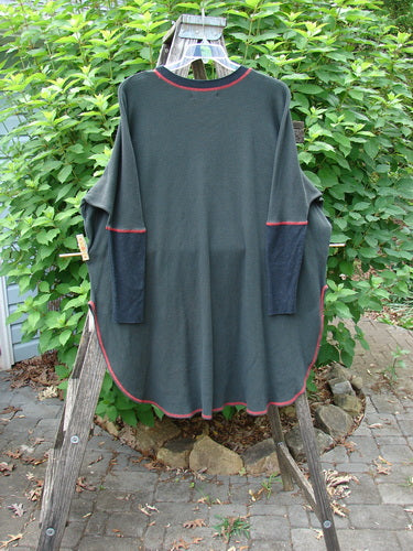 Barclay Thermal Contrast Revival Top Unpainted Black OSFA hanging outdoors, showcasing ribbed sleeves, rounded neckline, and A-line shape with side vents, highlighting its medium-weight cotton thermal texture.