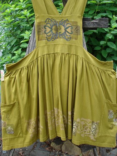 Barclay Overall Jumper Celtic Sun Glazed Tile OSFA, featuring a creatively cut bib, full gathered skirt, oversized pockets, and crisscross straps, highlighting a vintage design from Bluefishfinder.com.