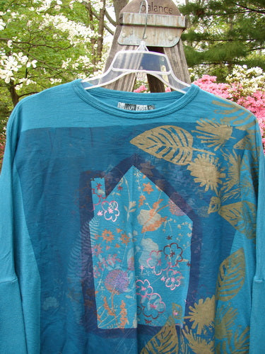 Barclay Crop Rib Sleeve Top Woods Home Aqua OSFA with dolman sleeves, ribbed accents, and a wide hem. The floral design enhances its vintage, boxy shape, reflecting Bluefishfinder's creative, expressive style.