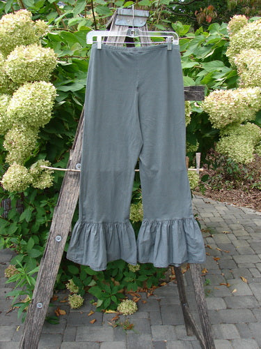 Barclay NWT Poplin Bottom Pantaloon Unpainted Chimera Size 0, featuring an elastic waist, straight-leg cut with ruffled flounces at ankles, hanging on a wooden ladder outdoors, perfect for versatile styling.