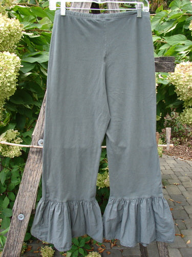 Barclay NWT Poplin Bottom Pantaloon Unpainted Chimera Size 0, wide-leg pants with ruffled hems displayed against a garden backdrop. Features an elastic waist and cropped length, embodying Bluefishfinder's vintage style.