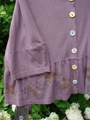 Barclay Peplum Pocket Jacket Magic Garden Dusty Plum Size 2, featuring a ceramic button front, three-quarter sleeves, and a painted peplum design, displayed in a close-up view.