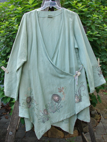 Barclay Viscose Long Ribbon Side Tie Jacket Garden Folly features a textured hemp-viscose fabric with a single thick ribbon closure and unique painted hemline details, capturing BlueFishFinder's vintage style.