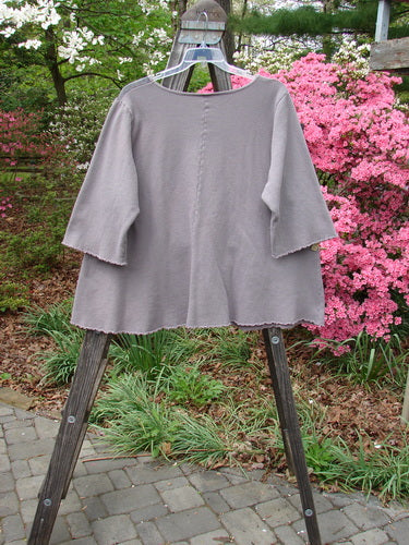 Barclay Fleece Cafe Sweatshirt Poet Garden Shaunting Stone Size 2 displayed on a hanger, featuring a rounded neckline, three-quarter length sleeves, exterior cargo pockets, flared hemline, and curly edgings.