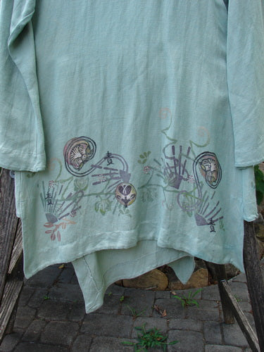 Barclay Viscose Long Ribbon Side Tie Jacket Garden Folly Kelp Size 0 features a single ribbon closure, painted hemline, and unique seams, captured in close-up highlighting its exquisite textile pattern and craftsmanship.