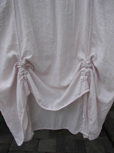 Barclay NWT Textured Batiste Linen Haystack Dress Unpainted Translucent Size 0, featuring loosely draped fabric with two ruched draw-string points creating a central swagged fold, embodying airy elegance.