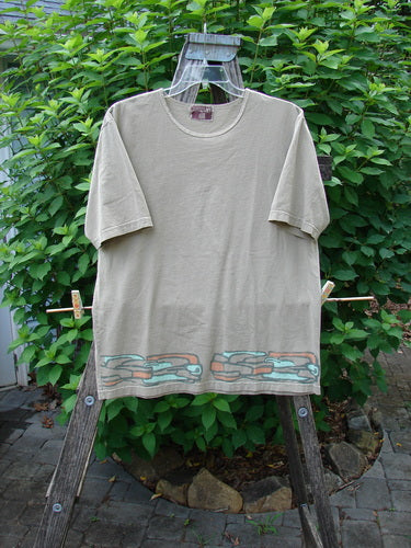 Barclay Short Sleeved Tee Stone Path Border Wheat Size 1 displayed on a swinger, showcasing its rounded neckline and straight wide shape, reflecting Bluefishfinder.com's vintage style and individual expression focus.