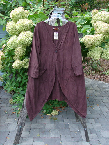 Barclay NWT Linen Geoides Pocket Duster in Armagnac Red Plum, Size 1, hangs from a stepladder, showcasing its draped open front and long sleeves, embodying Bluefishfinder.com's vintage-inspired style.