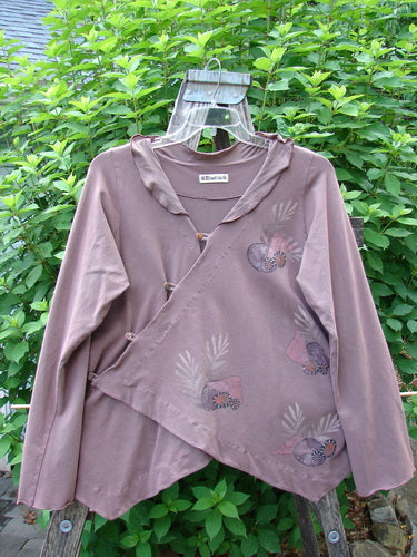 Barclay Cotton Lycra Tiny Button Cross Over Top Galaxy Dusty Burgundy Size 0 featuring a unique cross over button wrap front, flowing batiste collar, varying hemline, and vertical gathered sides.