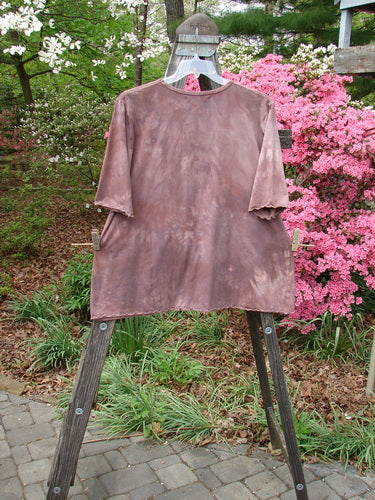 Barclay Three Quarter Sleeved Cafe Tee Vase Mottled Mushroom Size 2 displayed on a wooden stand, showcasing its textured organic cotton fabric and unique vase-themed design, ideal for spring collections.