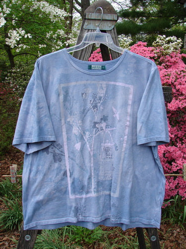 Barclay Short Sleeved Tee Bird Cage Mottled Sky Size 2 displayed on a hanger, showcasing its rounded neckline, drop shoulders, wide sleeves, and boxy shape with birdcage design.