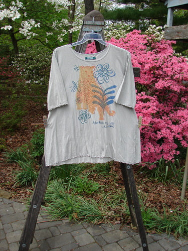 Barclay Three Quarter Sleeved Textured A Line Tee Wild Cat Live True Cloud Size 2 displayed on a rack, featuring a tiger design and three-quarter sleeves with a rounded neckline.
