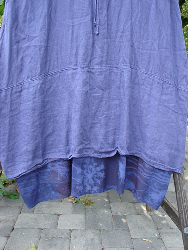 Barclay NWT Linen Process Two Story Dress Mum Ultra Violet Size 0, featuring a two-layered ankle-length design with a solid linen top and botanical-patterned percale underskirt, hanging outdoors.