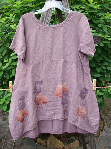 Barclay Linen Urchin Dress Necklace Leaf Dusty Plum Size 0 showcases a medium-weight linen fabric, featuring a unique hemline, downward waist seam, and floral painted design, epitomizing Bluefishfinder.com's vintage-inspired creative expression.