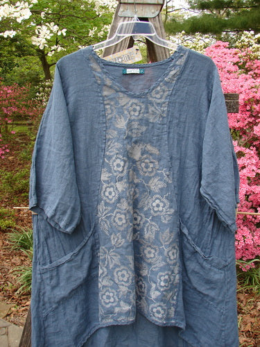 Barclay NWT Linen Posey Tunic Buttercup Patch Blue Echo Size 2, featuring a floral design, three-quarter sleeves, and two oversized pockets, displayed on a mannequin.