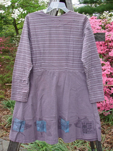 1999 Fitted Circle Dress Dried Pod Grey Plum Stripe Size 0 displayed on a clothes rack, showcasing its flared skirt, empire waist seam, vertical bodice pleats, and cozy long sleeves.