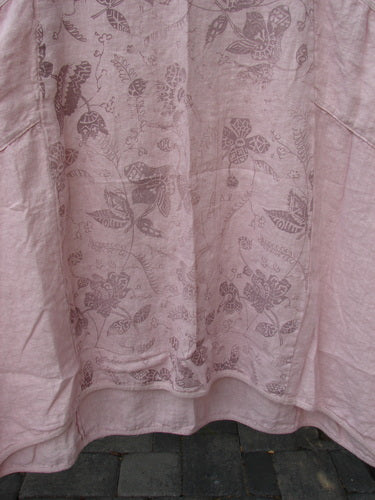 Barclay NWT Linen Le Jardin Cotton Sleeve Pocket Dress Victorian Floral Petal Size 0, featuring a pale pink linen with darker-pink floral motifs, displayed hanging above a cobbled surface.