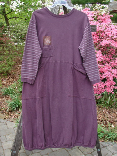 1999 Teacher's Dress Forest Sprig Blackberry Stripe Size 2 displayed on a mannequin, showcasing unique prints, gathered elastic ribbing on cuffs, neckline, hemline, and two large exterior wrap-around pockets.