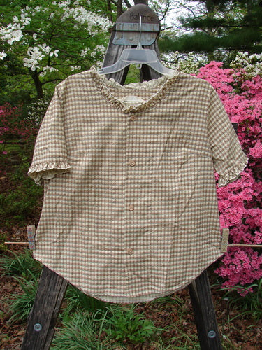 1996 Woven Boardwalk Top Unpainted Gingham White Pine Size 2 displayed on a hanger, featuring gathered ruffle neck and sleeve lines, rounded hem, and bust line darts.