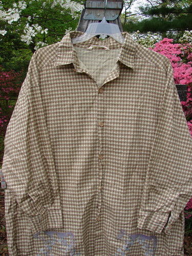 1996 Woven Tourist Top Farm Cow White Pine Gingham OSFA displayed on a hanger outdoors, highlighting its tiny wooden buttons, rollable lower sleeves, vented sides, and stand-up collar.