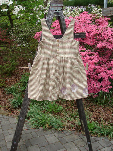1996 Woven Roadside Jumper Flower Wheel White Pine Gingham Size 1 displayed on a wooden stand, featuring wooden buttons, pleated blousy lower, squared neckline, and painted flower wheel theme.