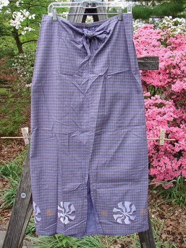 1996 Woven Clambake Skirt Wind Pinwheel Niagara Gingham Size 2 hanging on a clothesline, showcasing the partial front tie waist and back elastic waistline.