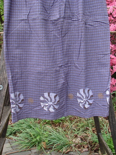 1996 Woven Clambake Skirt Wind Pinwheel Niagara Gingham Size 2 displayed on a wooden rack, showcasing its partial front tie waist and rear elastic.